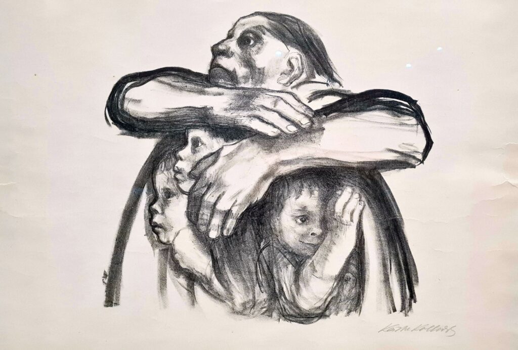 A photograph of a rough sketch of a frightened woman huddled over three young children her arms raised above her shoulders and wrapped around their heads protectively.