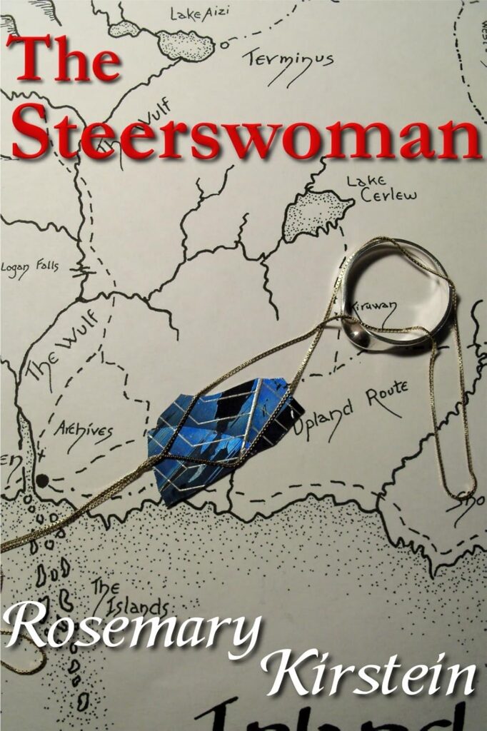 The cover of the steerswoman is a map with places like The Wulf, Lake Cerlew and Upland Route marked on it. Over the top of the map is a silver chain, on the chain is a silver ring with a simple stone, underneath the necklace is a scrap of blue with white veining in a chevron pattern