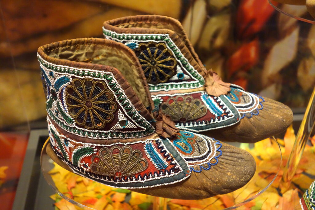 photograph of colorfully beaded Huron moccasins c 1880 from the Bata Shoe Museum